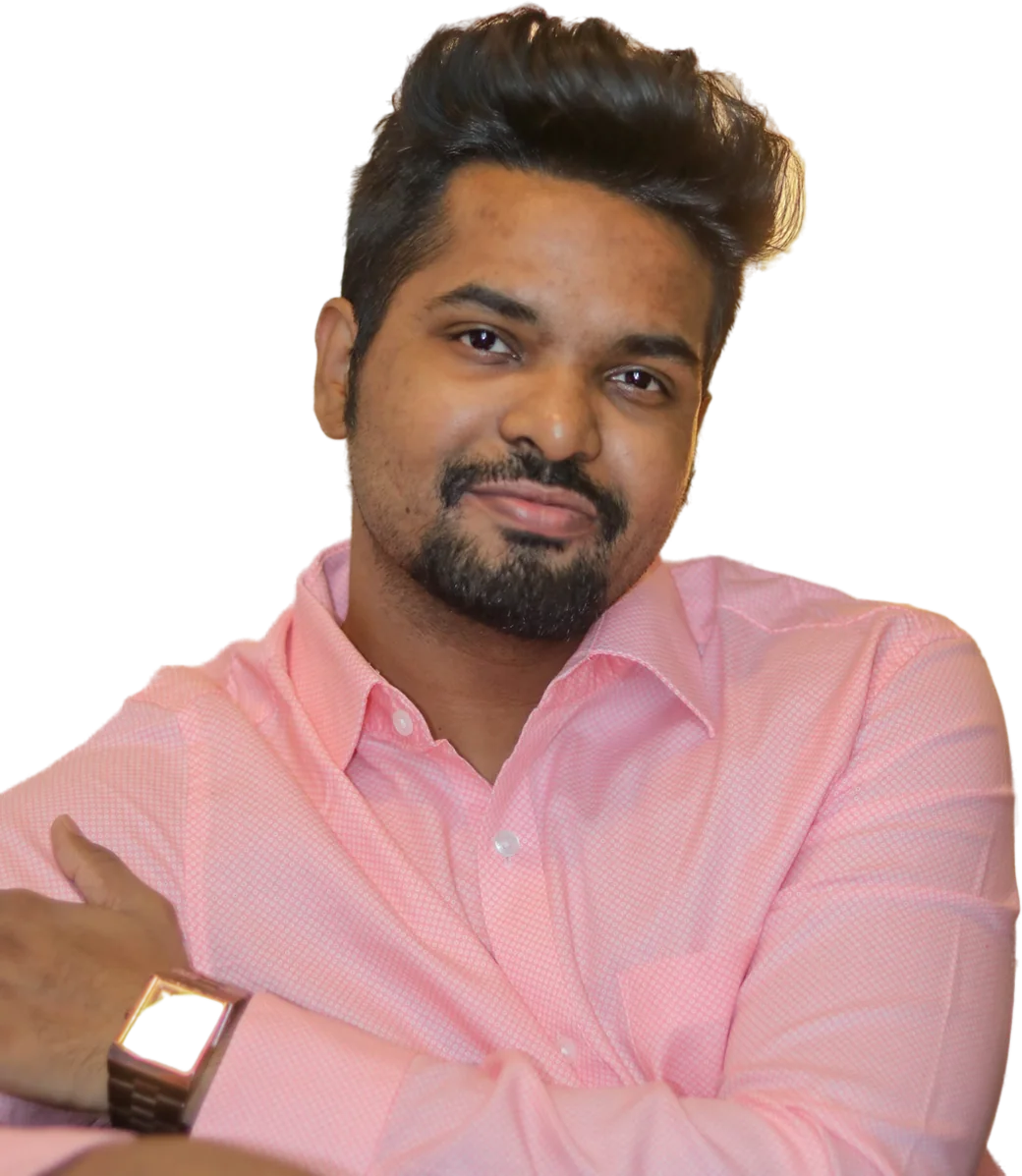 Ashish Tadigiri, arms crossed, smiling